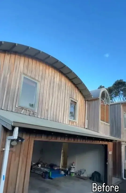 Curved-roof Auckland home before painting with weathered natural timber