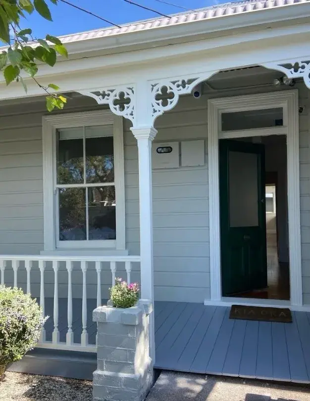 Heritage Auckland villa with freshly painted exterior in soft grey and white
